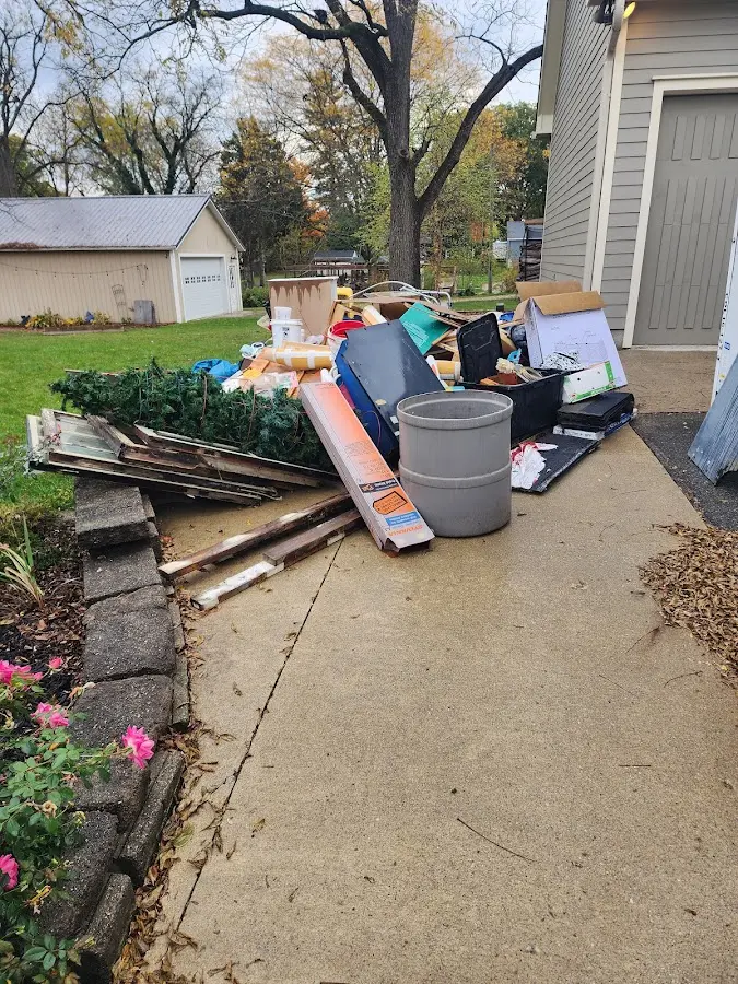 Dumpster being loaded with debris for 3 Yard Dumpster Rental in Johnstown